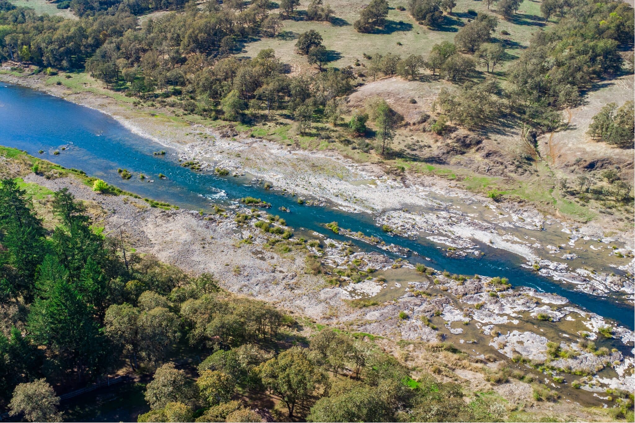 Aerial drone view of a river winding through an Oregon valley — real estate photography by Hahn Media, Oregon